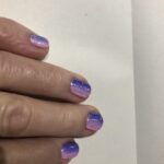 alt="fingers with two colour nails"