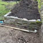 alt="new wall for flower bed"