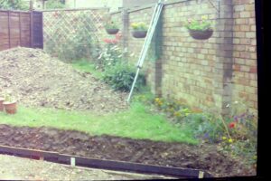 alt="garden with footings for a wall"