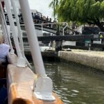 alt="edge of boat going along canal"
