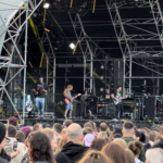 alt="lead guitarist on stage"