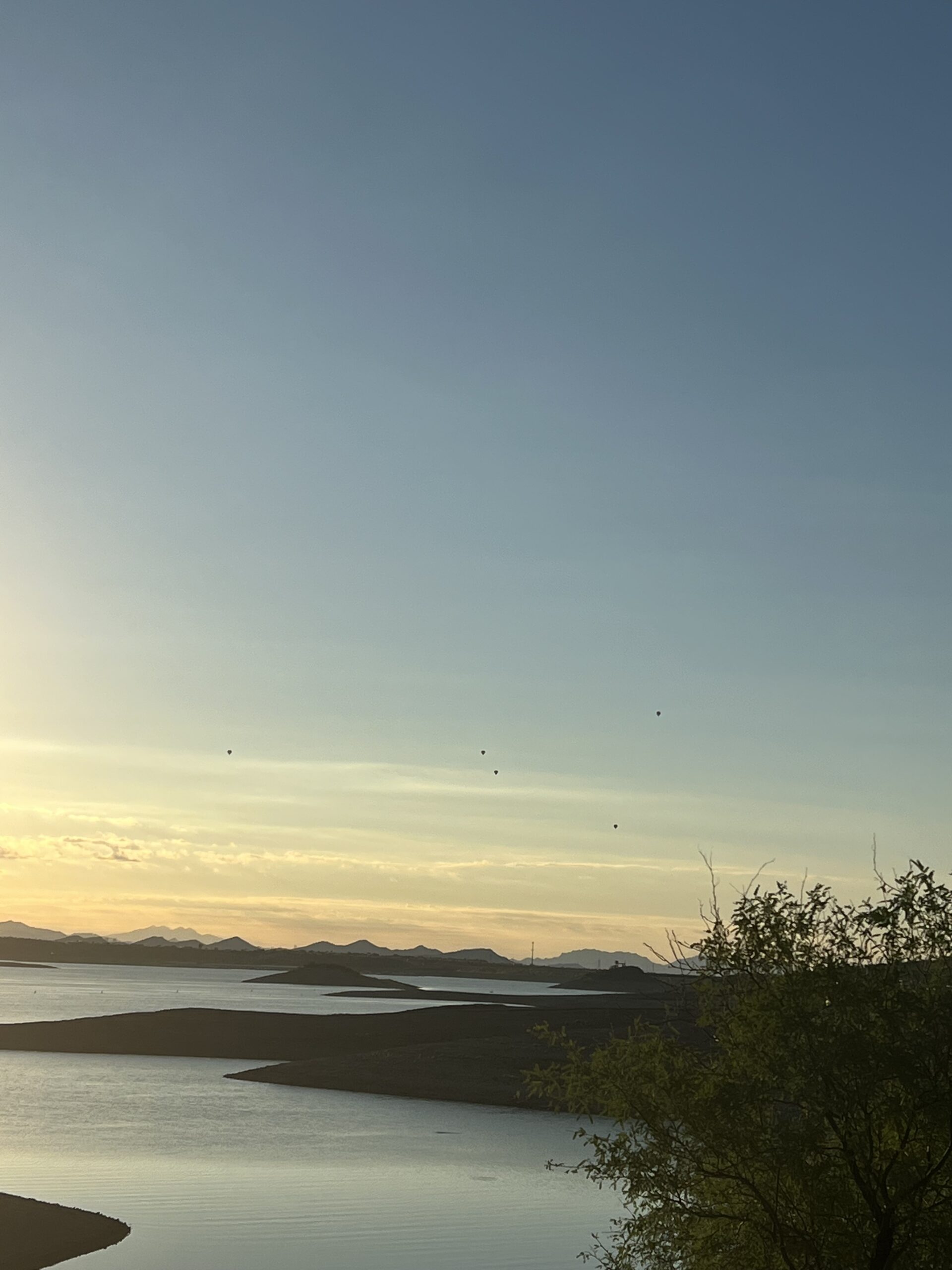 alt="lake with shore at dusk"