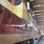 alt="side of train in the station"