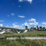 alt="bridge with city in background"