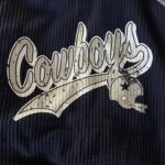 alt="cowboys logo on a fabric top"