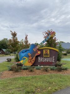 alt="front entrance to KOA site with big guitar"