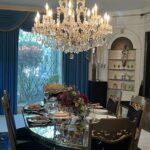 alt="chandelier above a dining room table"