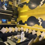 alt="bold geometric pattern on the walls of a sitting room"