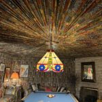 alt="pleated material covering ceiling above a snooker table"