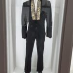 alt="stage outfit with gold thread embroider"