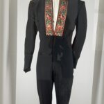 alt="stage costume with red & gold pattern"
