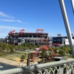 alt="on a bridge looking at a stadium"