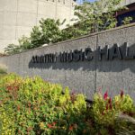 alt="outside wall of country music hall of fame"