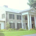 alt="side& front porch of mansion"