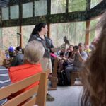 alt="person demonstrating a bird of prey"