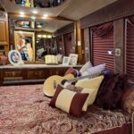 alt="bed with cushions & guitars"