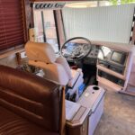 alt="inside cab of tour bus"