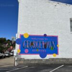alt="wall with George Town written on it"