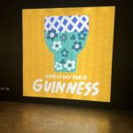 alt="poster with glass filled with flowers"