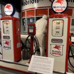 alt="two old fashioned petrol pumps"
