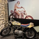 alt="motorbike with image of rider in background"