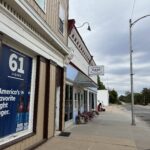 alt="high street with shops & cafe"