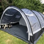 alt="tunnel like tent with dog in porch"