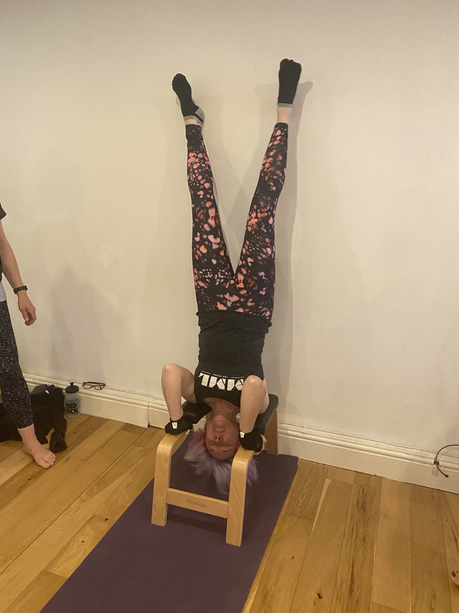 alt="person upside down"
