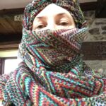 alt="person with scarf wrapped around head"