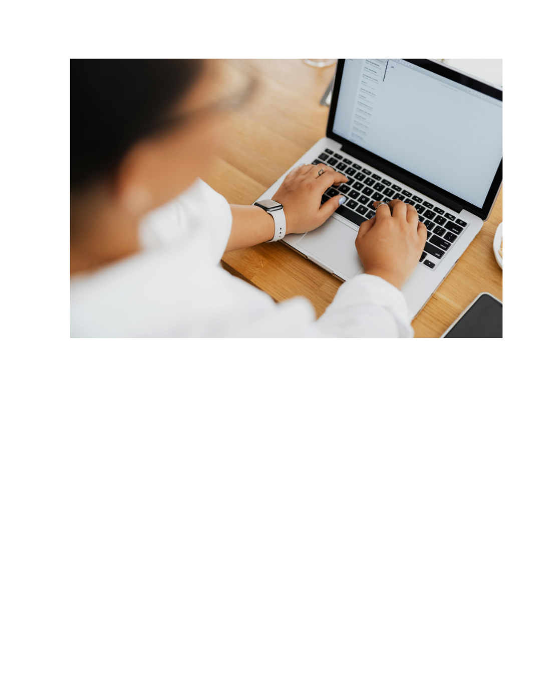 alt="person typing at computer"