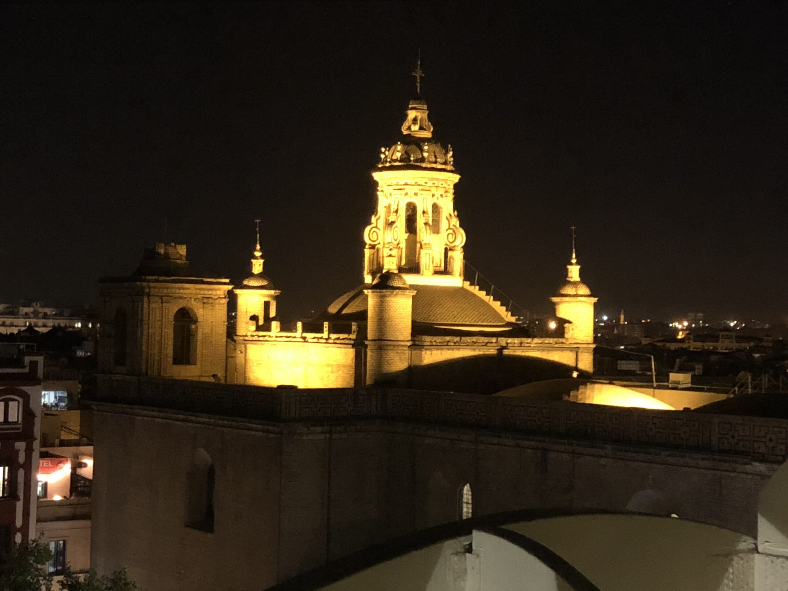alt="illuminated rooftops"