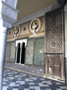 alt="mosaic tiles on a wall"