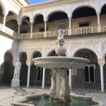 alt="fountain in a courtyard"
