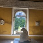 alt="statues & arched window"