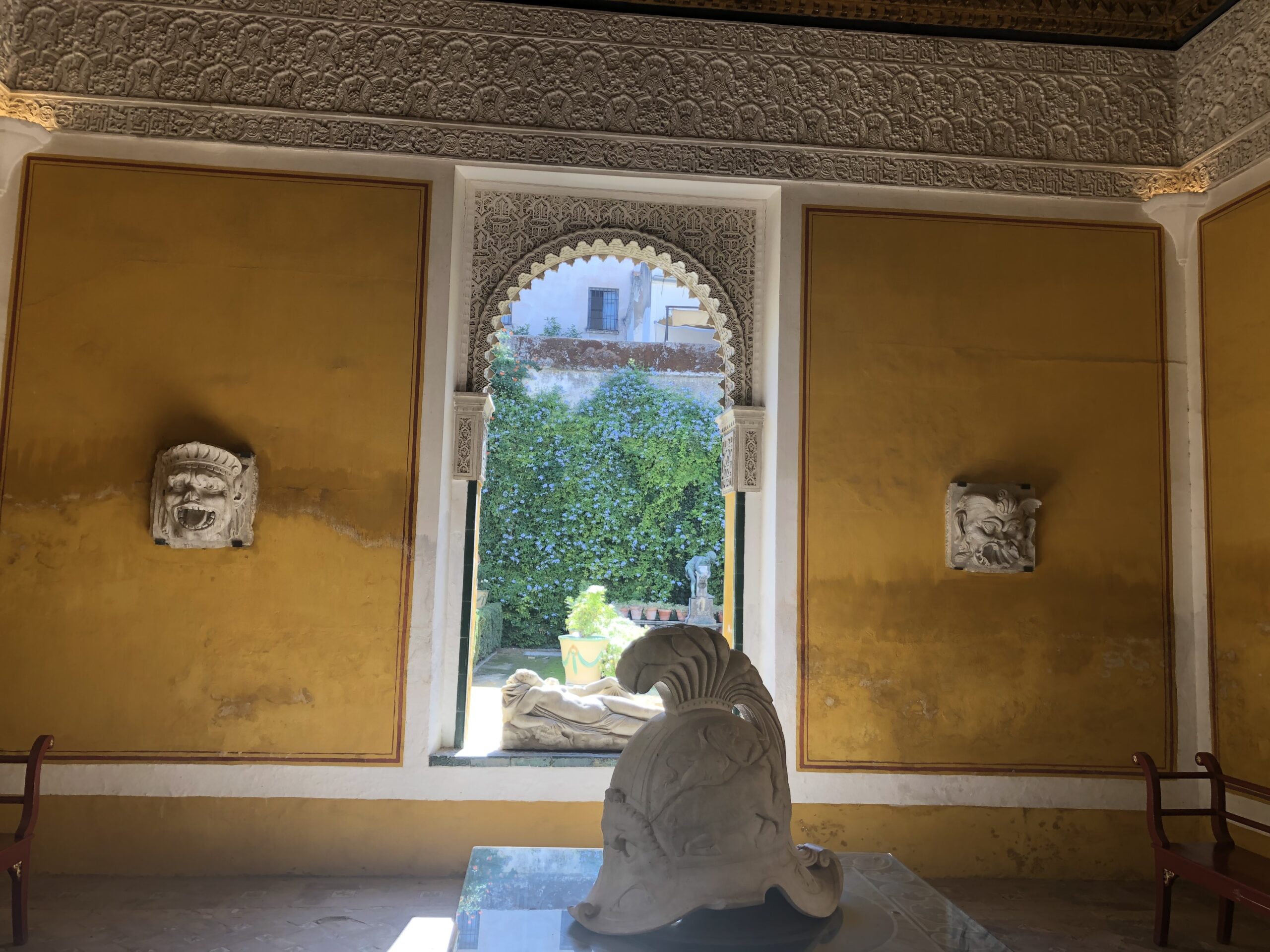 alt="statues & arched window"
