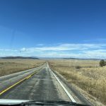 alt="long open road"