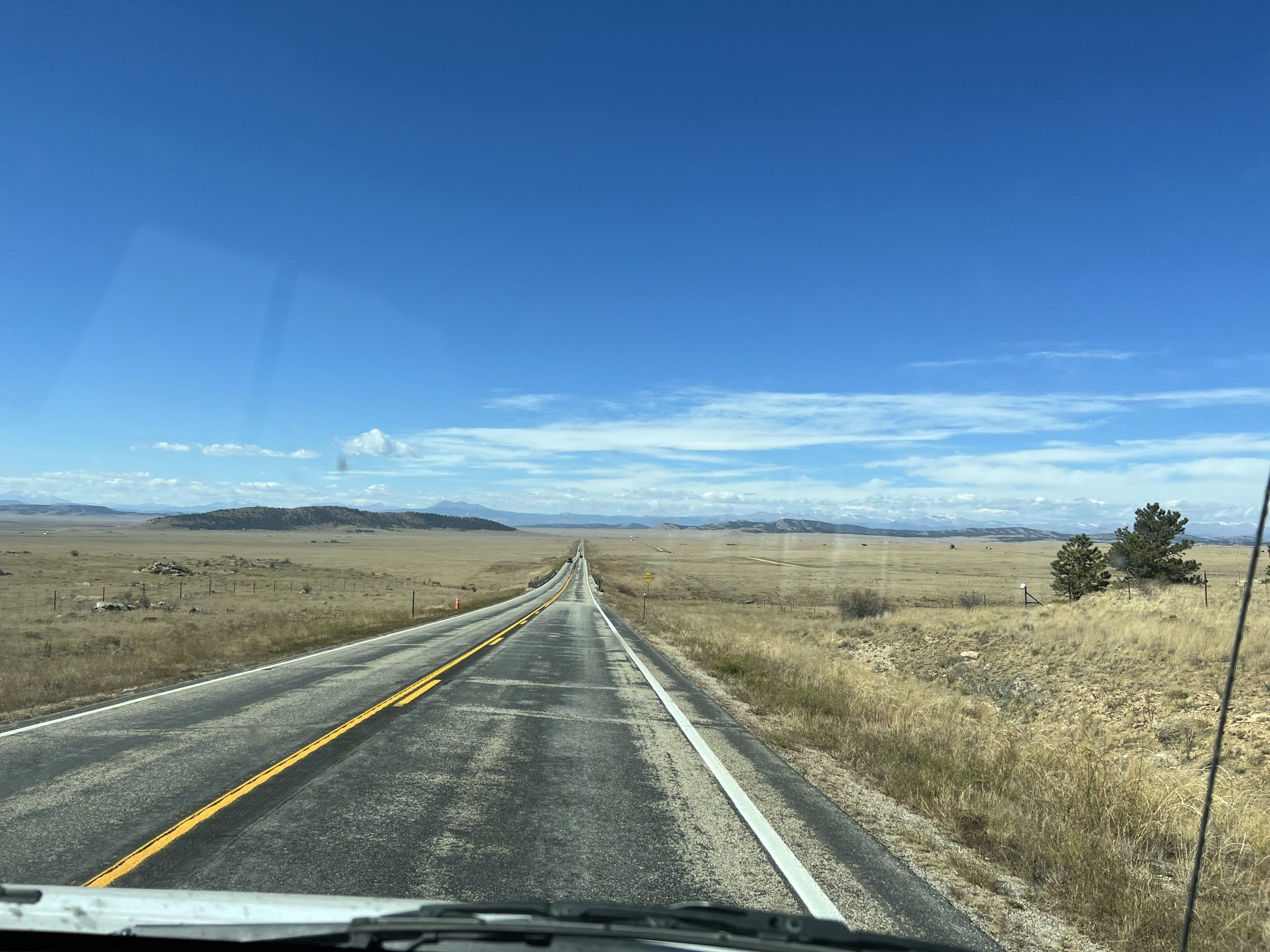 alt="long open road"