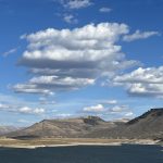 alt="mountains with clouds above"