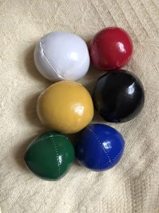alt="two sets of different sized juggling balls"