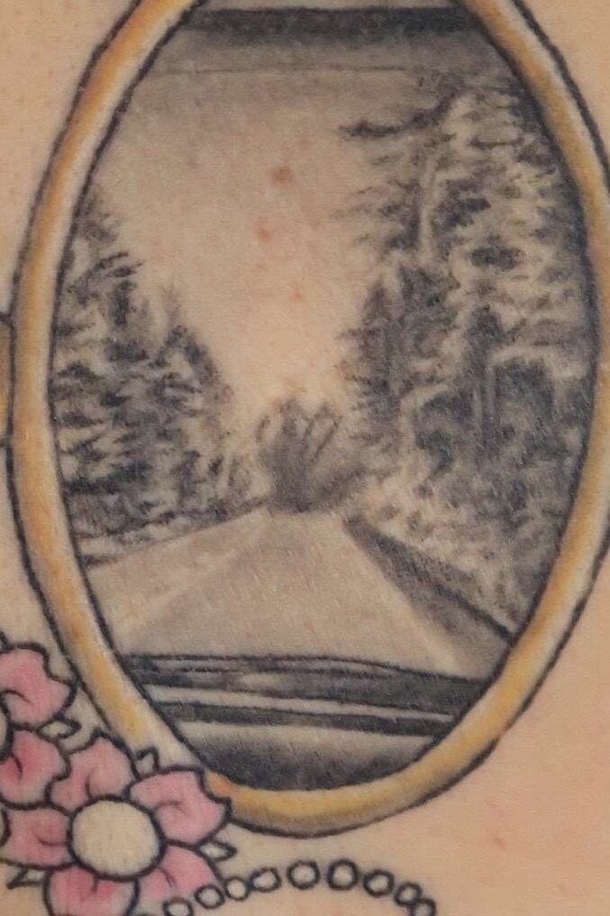 alt="image from tattoo which came from a photograph on a road trip"