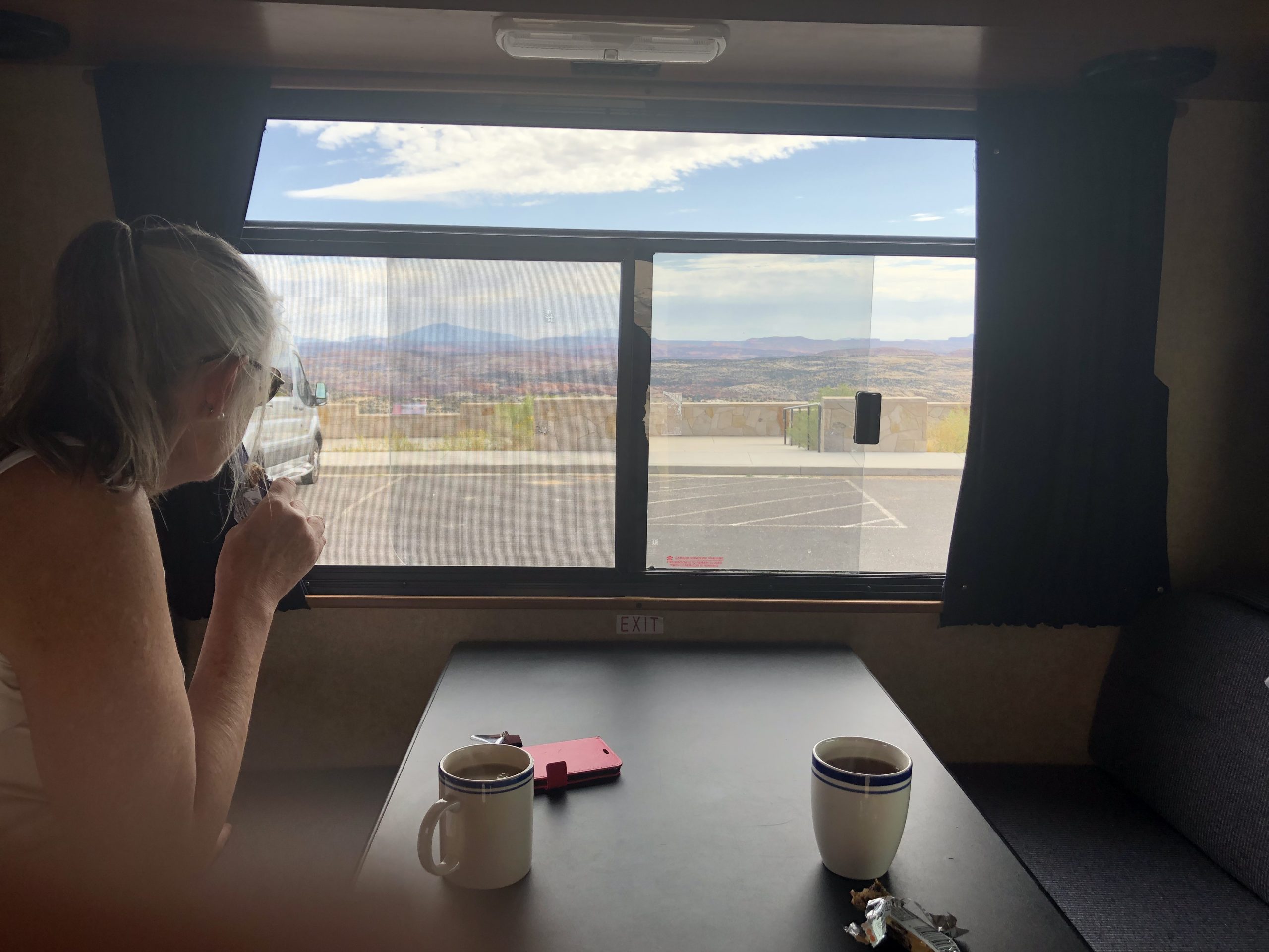 alt="table inside van with cups of tea"