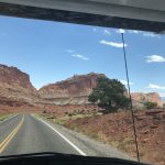 alt="road with huge rock formations each side"