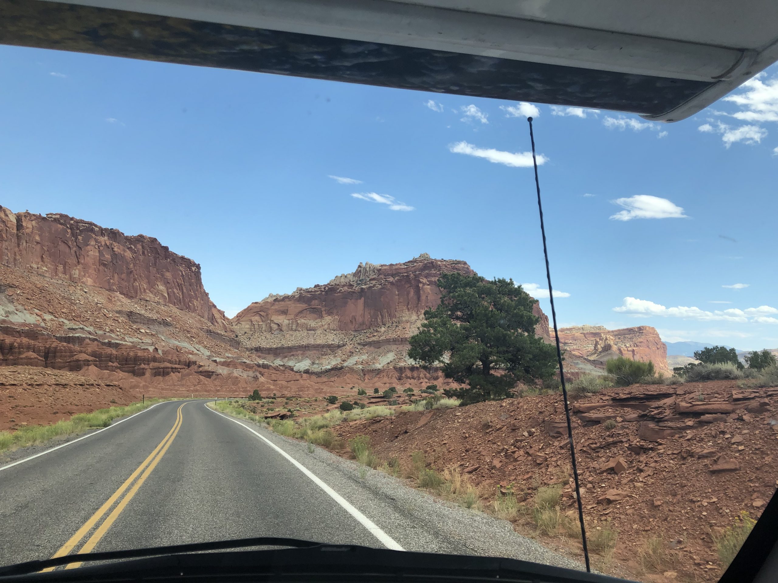alt="road with huge rock formations each side"