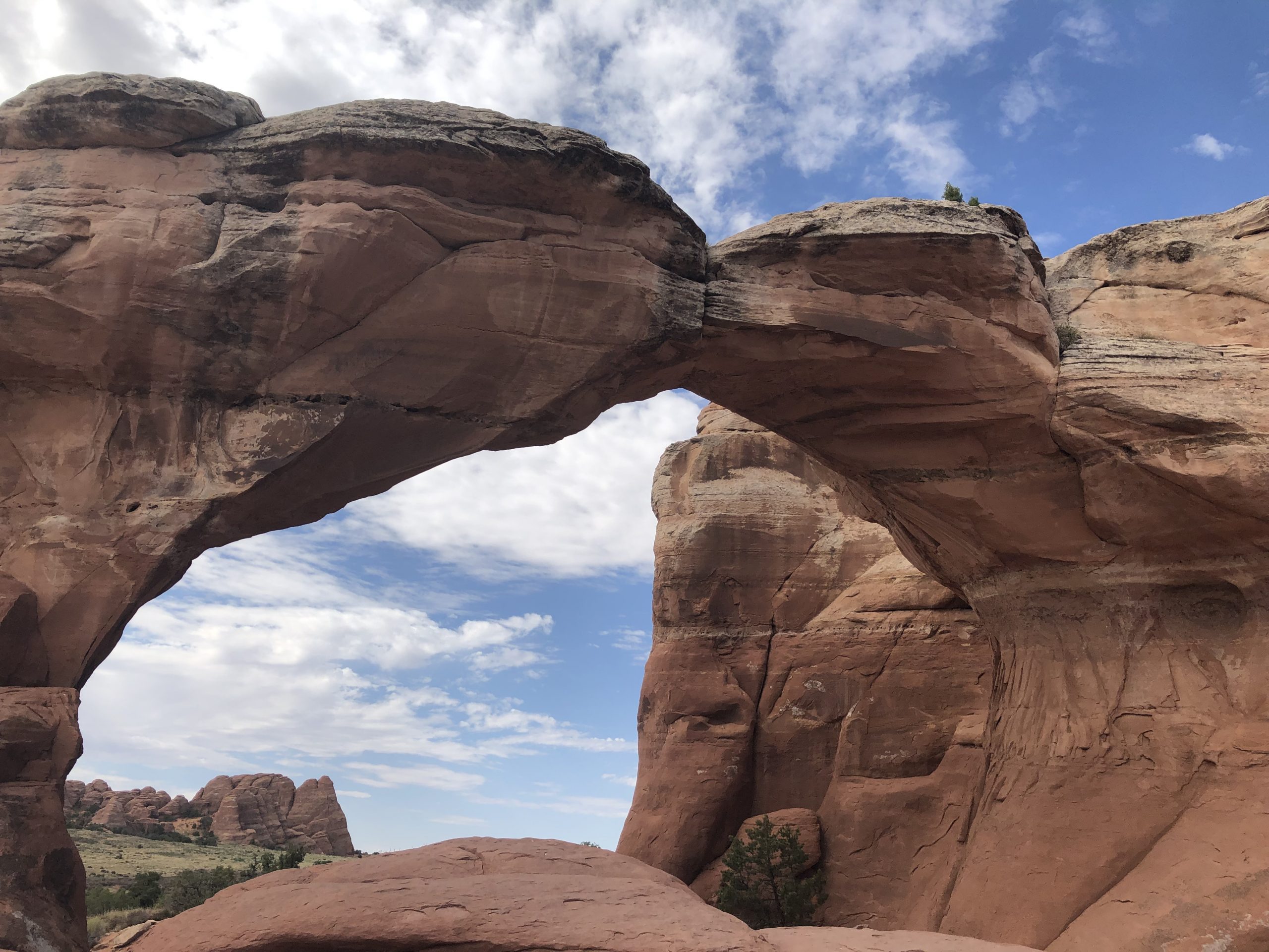 alt="rocks touching to form a archway"