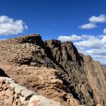 alt="exposed rocks & scree slopes ahead"