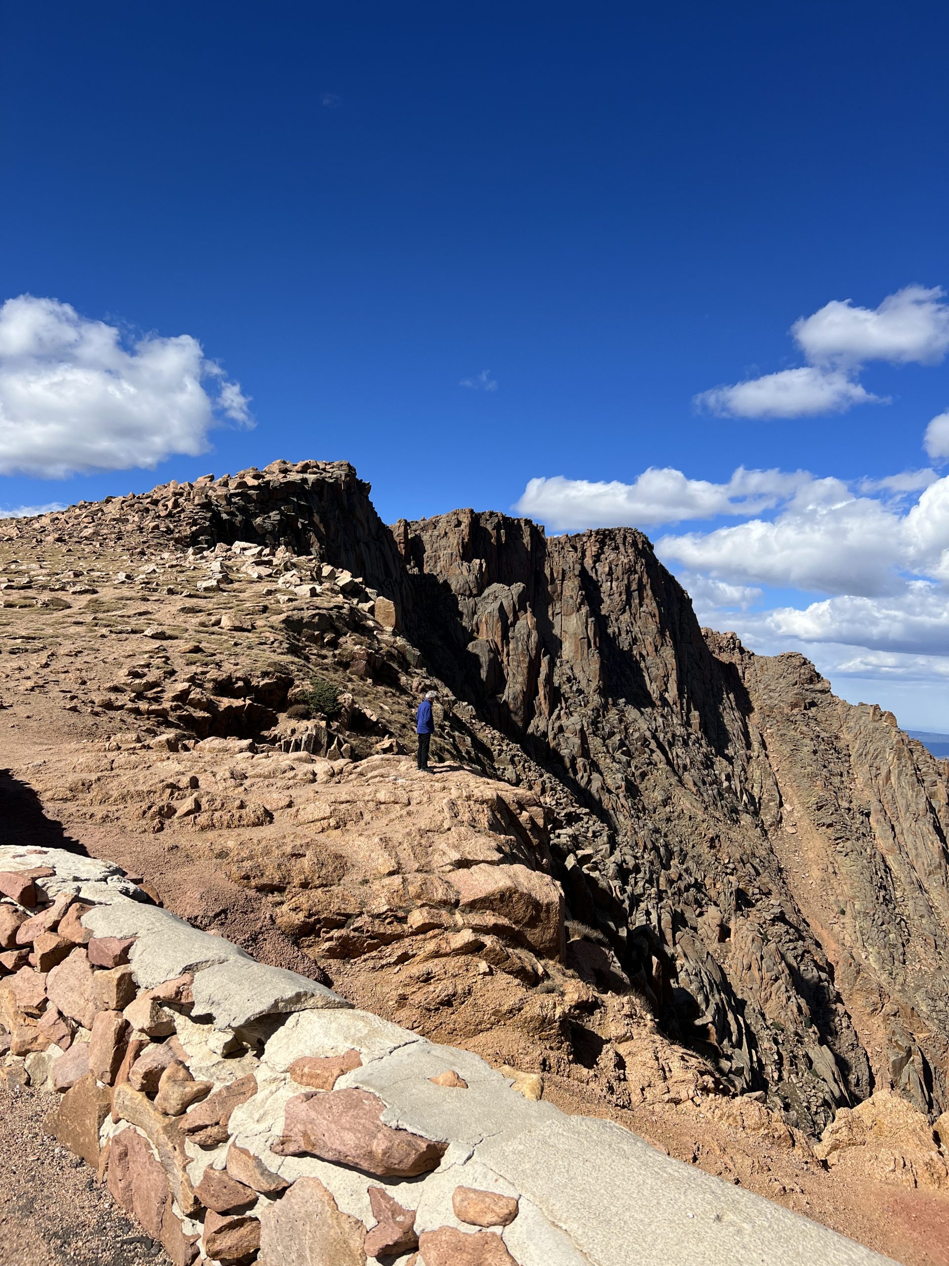 alt="exposed rocks & scree slopes ahead"
