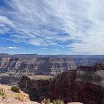 alt=" overlooking the edge at Grand Canyon with rock strata in lines"
