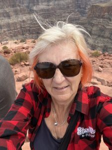 alt="a selfie of me at almost the same spot I took one a few years ago"