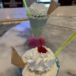alt="two cream based desserts in unusual shaped dishes"