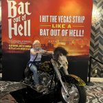 alt="me posing on a motorbike outside the Meatloaf Musical theatre"